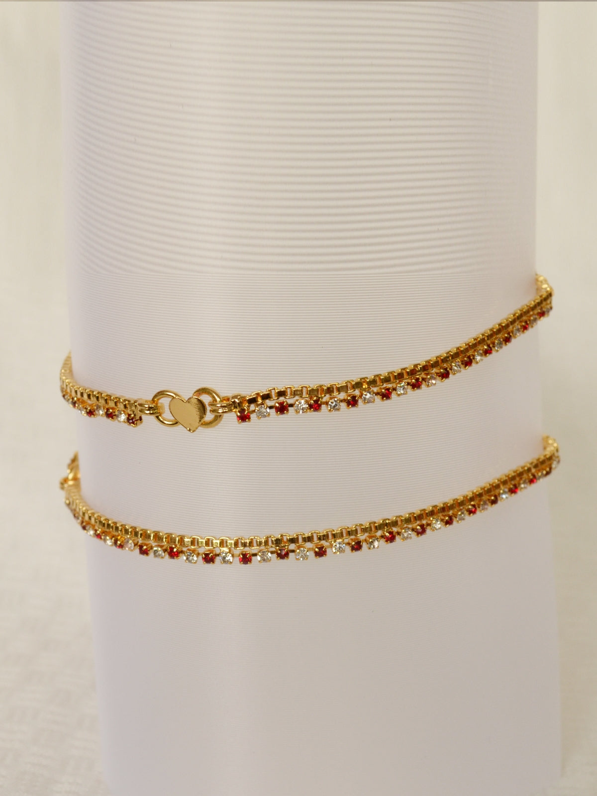 Gold plated anklet with maroon and white stones - by Shrayathi
