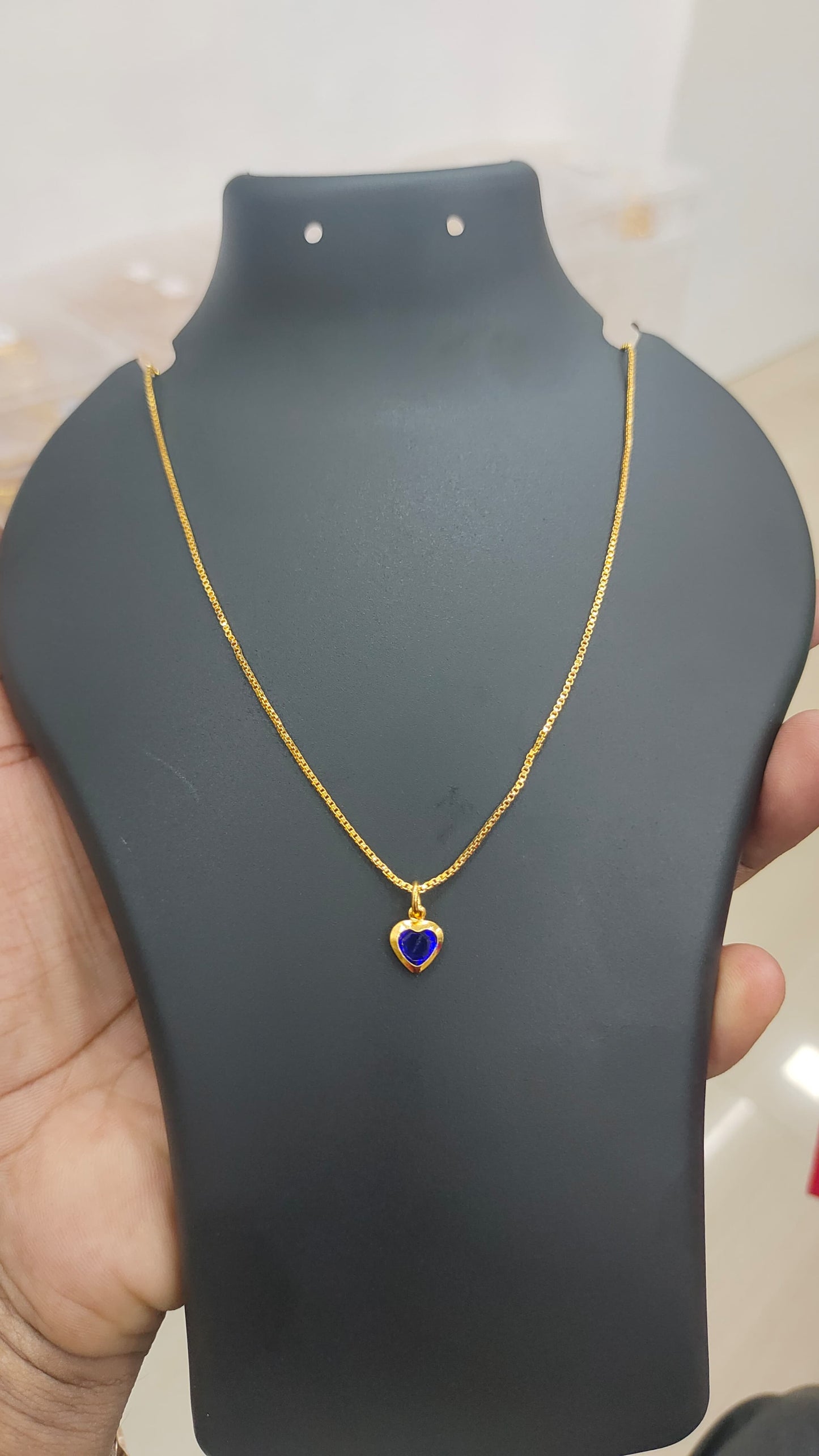 Gold plated chain and blue stone pendant