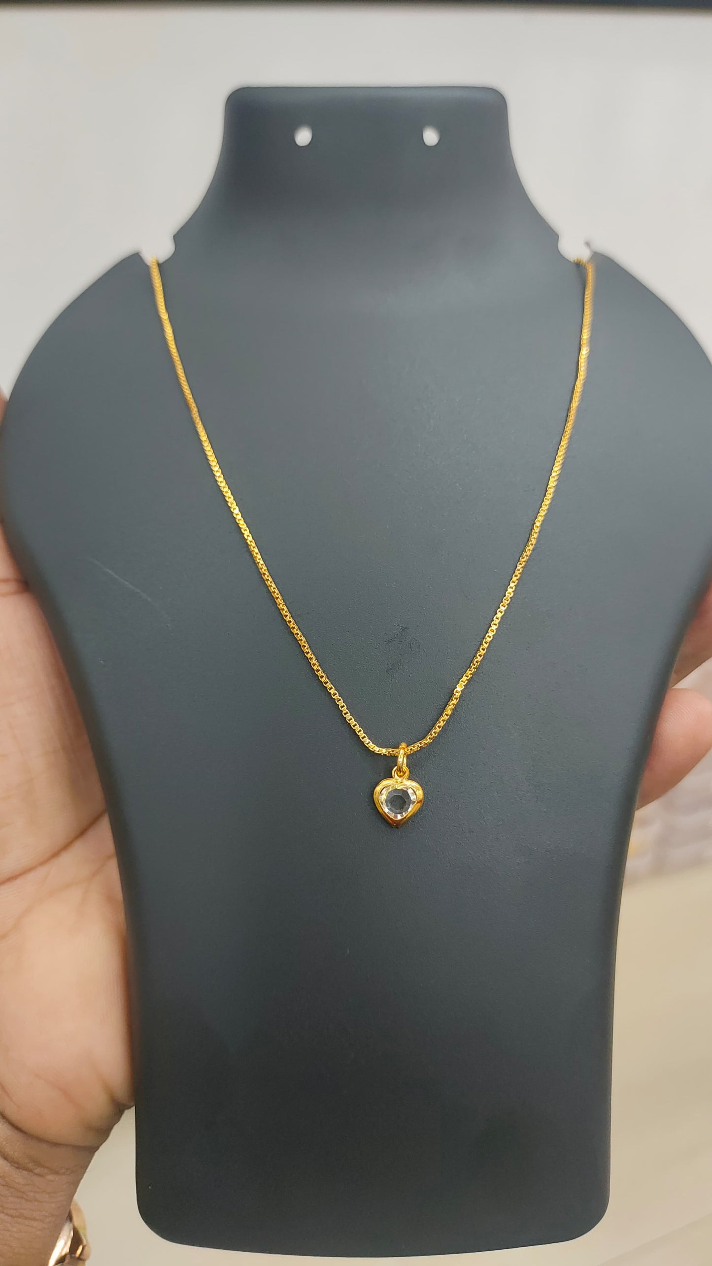 Gold plated chain and white stone pendant