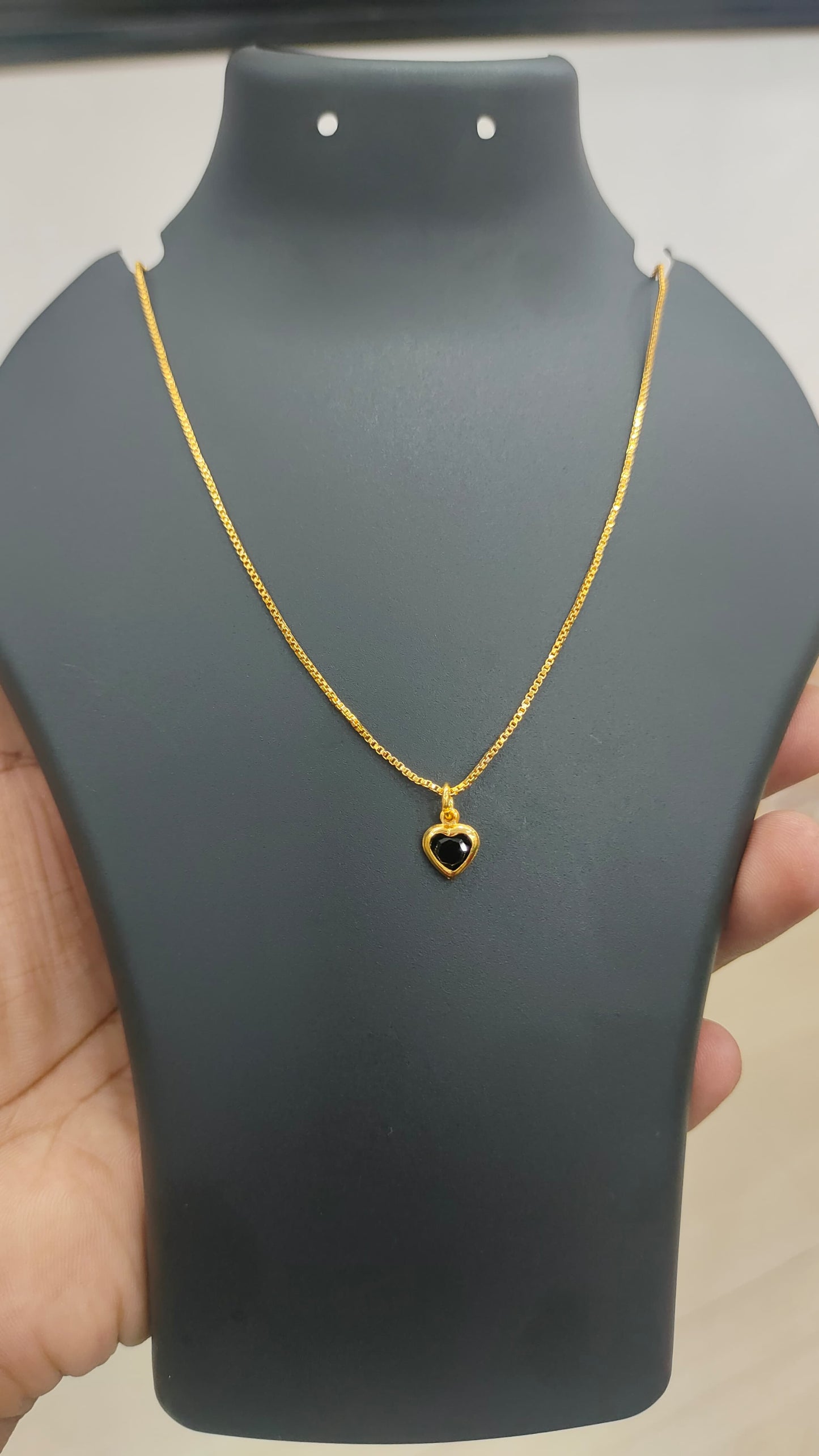 Gold plated chain and black stone pendant