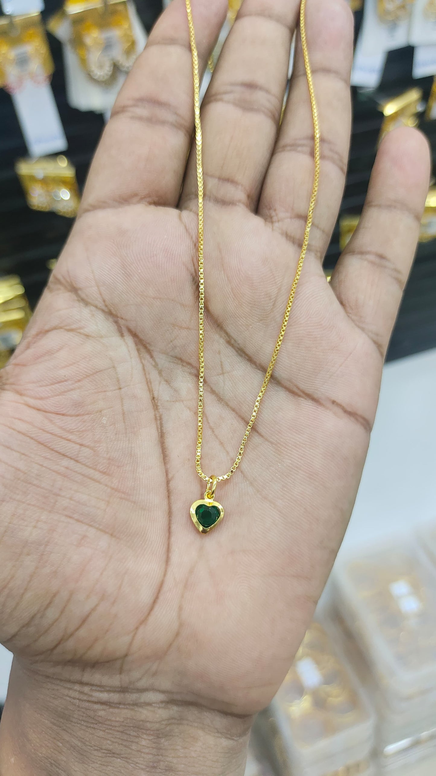Gold plated chain and green stone pendant