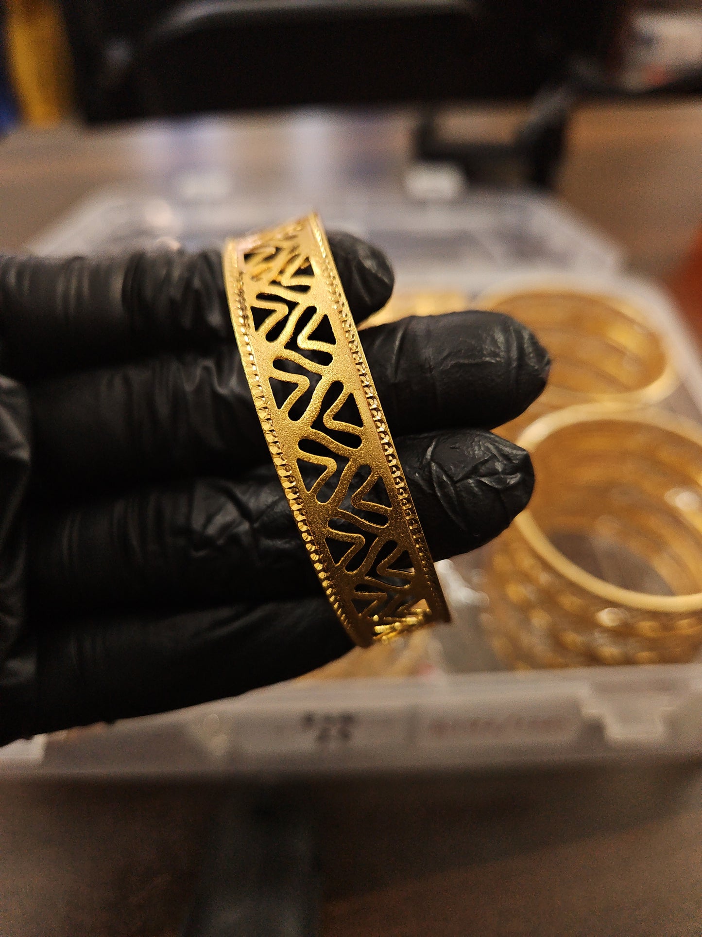 Gold plated shiny cut design bangle