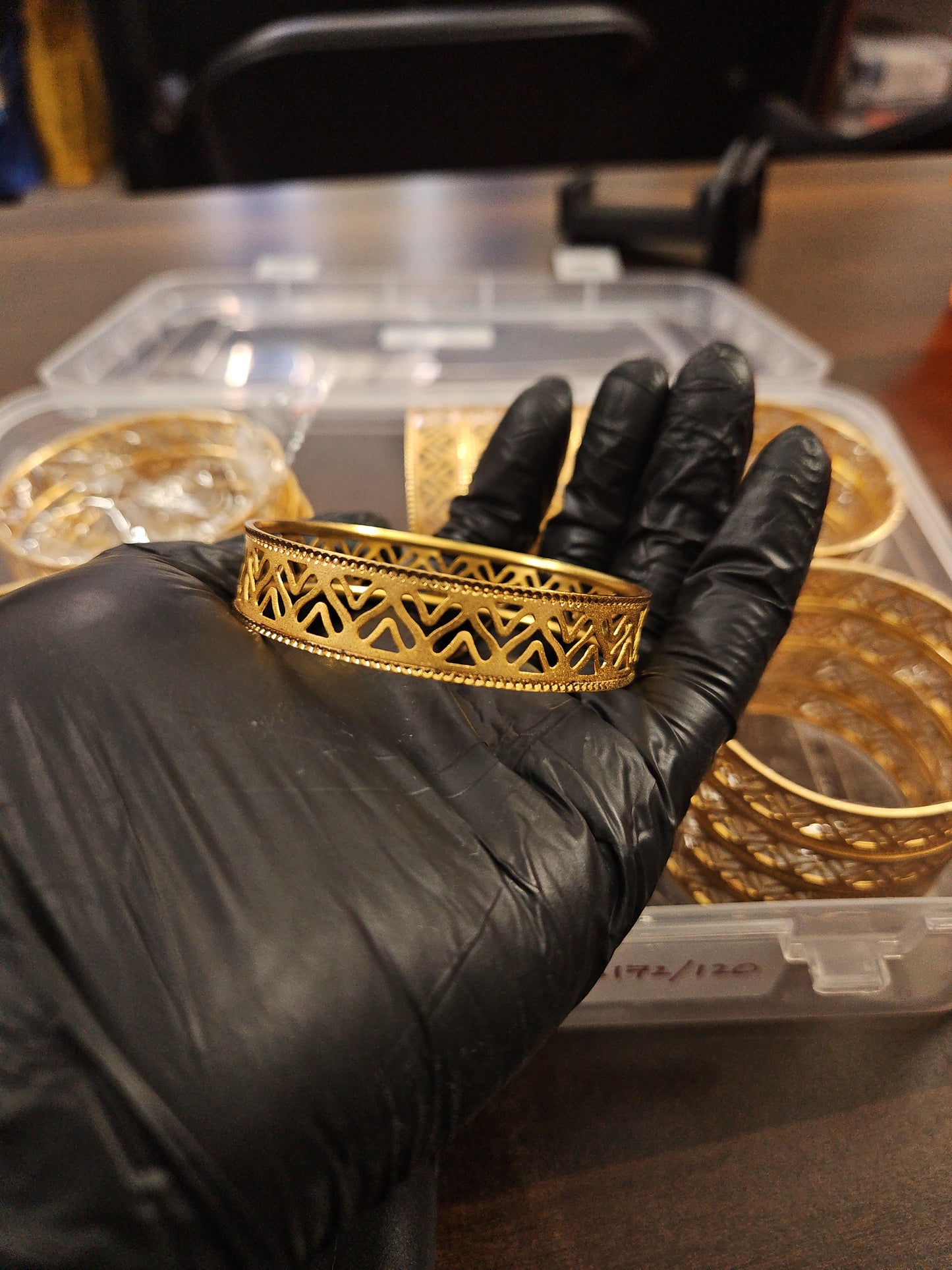 Gold plated shiny cut design bangle