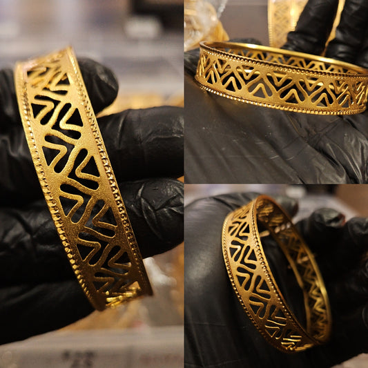 Gold plated shiny cut design bangle